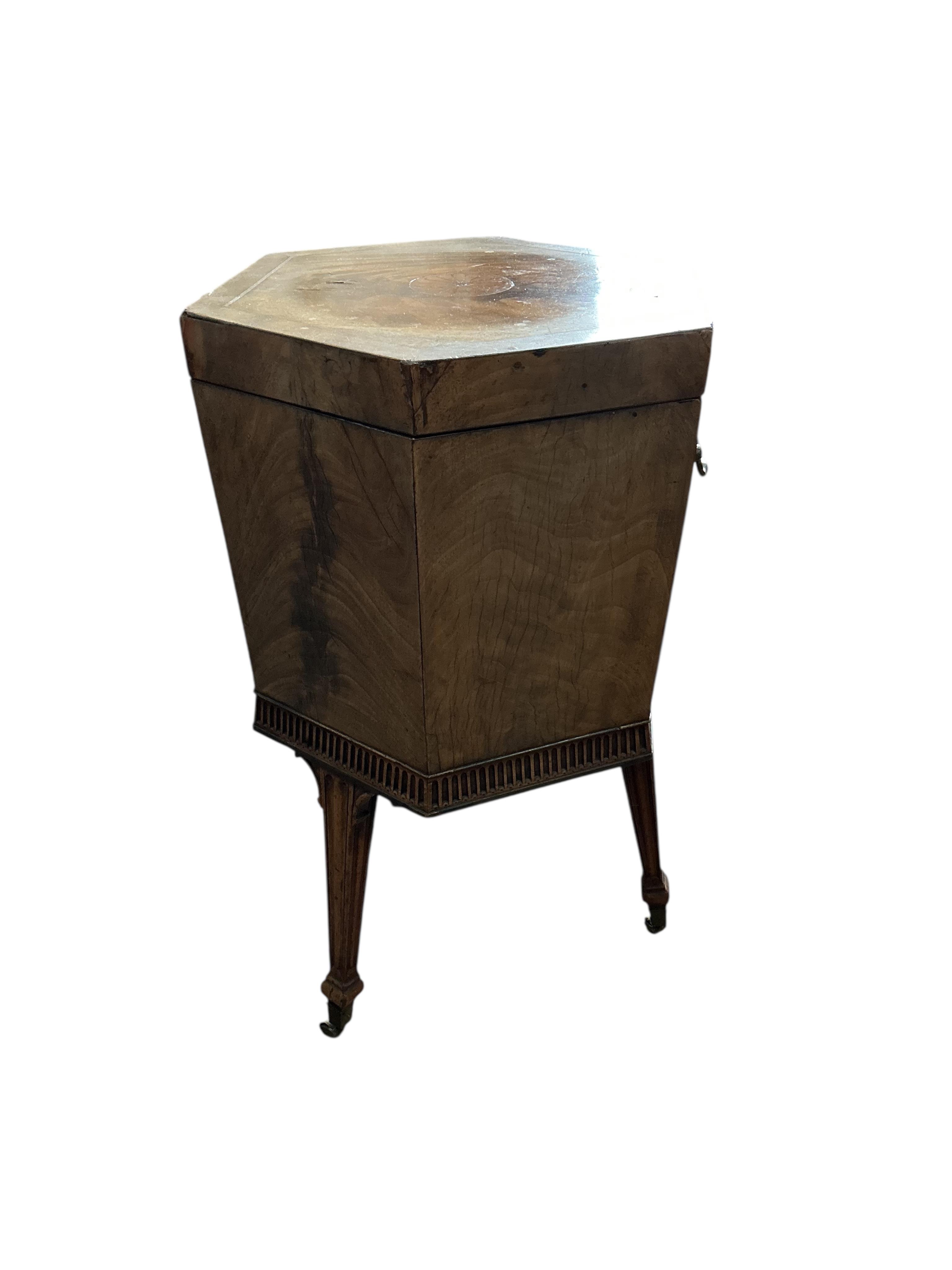 A George III inlaid mahogany hexagonal cellarette, width 47cm, height 75cm